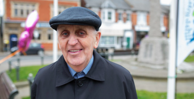 Elderly white male with a hat on.