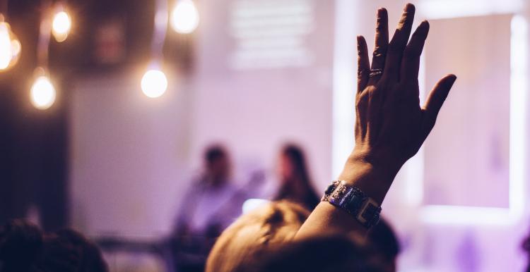 Raised hand at an event