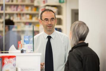 Pharmacist talking to patient