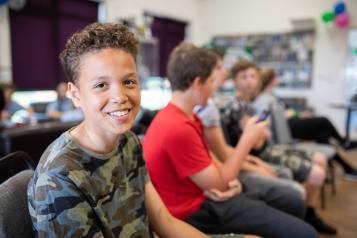 young boy smiling at the camera