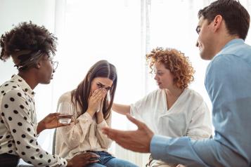 women crying she is confident by her peers  