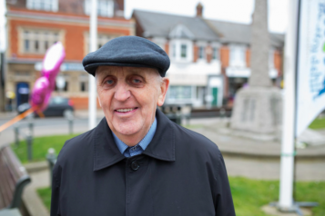 Elderly white male with a hat on. 