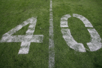 White number four and zero painted on grass
