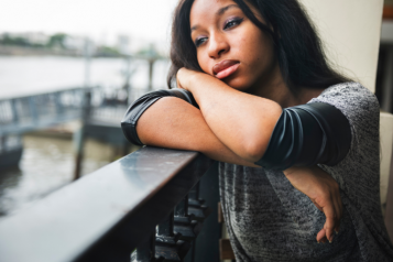 Young black female looking sad