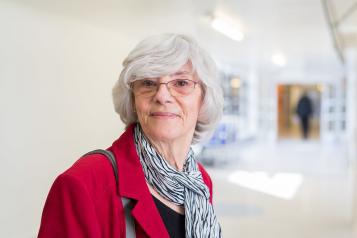 Woman stood in a hospital corridor Woman stood in hospital corridor