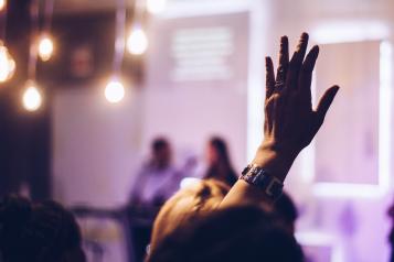 Raised hand at an event